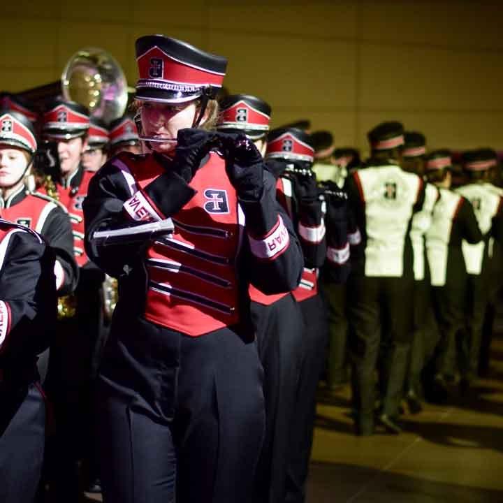 Flute section of the Raven Regiment marching band in uniform