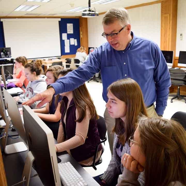 Students in a computer lab with Dr. Kevin Page